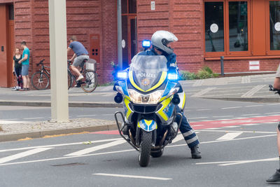 Man riding motorcycle on road