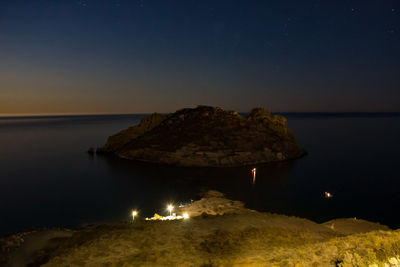 Scenic view of sea against sky at night