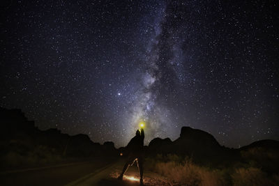 Scenic view of road against sky at night