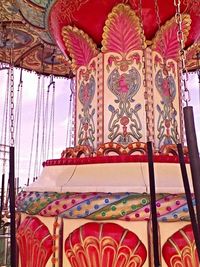 Low angle view of red wall against sky