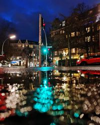 Reflection of illuminated buildings in water at night