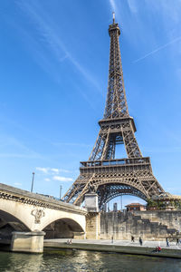 Paris,  the eiffel tower seen from a boat on the seine river