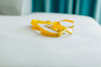 Close-up of wedding rings on table