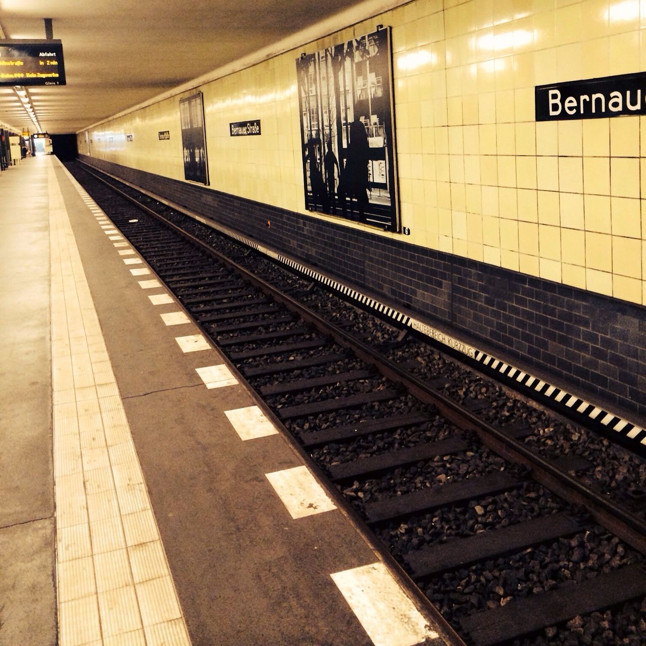 public transportation, text, railroad station, transportation, rail transportation, railroad station platform, railroad track, indoors, western script, communication, subway station, illuminated, information sign, train - vehicle, non-western script, travel, subway, subway platform, number, information