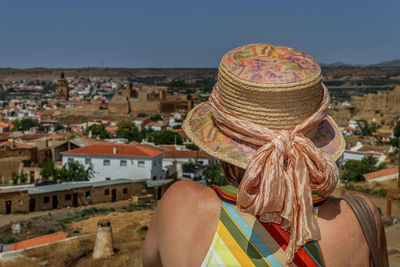 Rear view of woman against sky