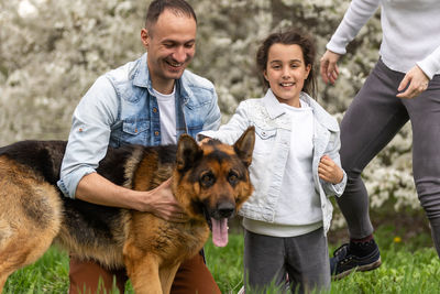 Midsection of man holding dog