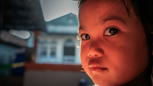 Close-up portrait of boy looking away