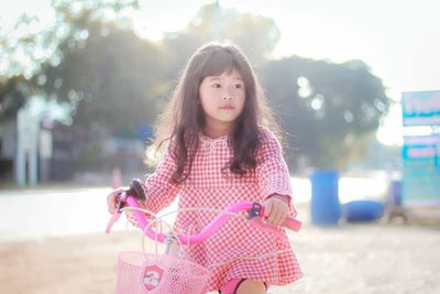 Close-up of girl riding bike