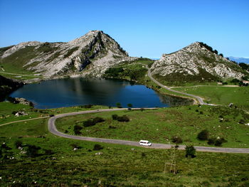 Scenic view of mountains against clear blue sky