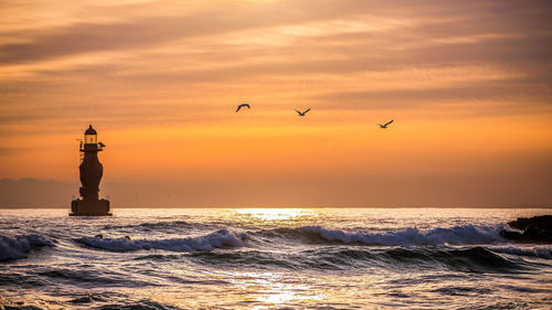 Scenic view of sea against sky during sunset