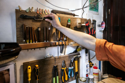 Unrecognized luthier woman in traditional workshop