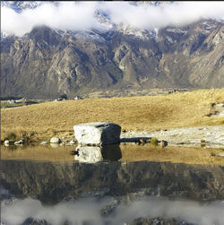 Scenic view of river and mountains