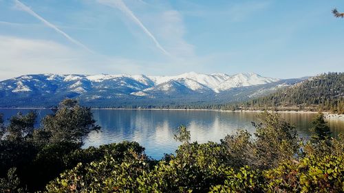 Scenic view of lake with mountains in background