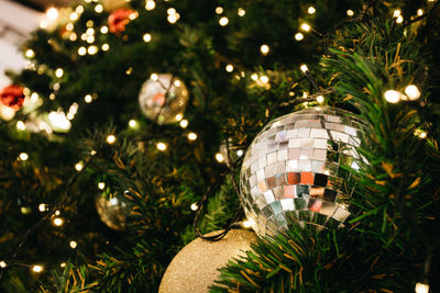 Close-up of illuminated christmas tree at night