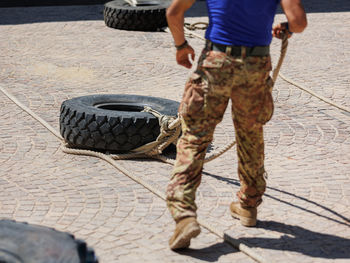 Military training- fitness workout and activities with huge truck tires.