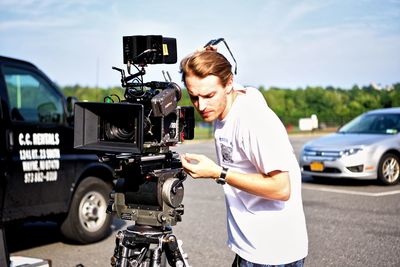 Man with camera in city