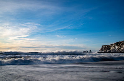 Scenic view of sea against sky during winter