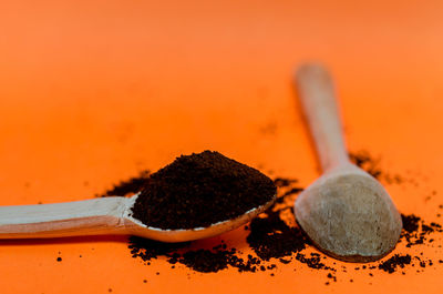 Close-up of ice cream against orange background