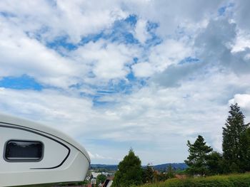 Cars on road against sky