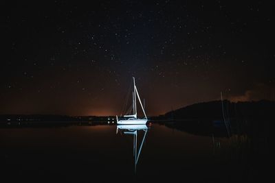 Scenic view of sea against sky at night