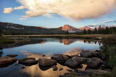Scenic view of lake and mountains against sky