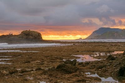 Scenic view of sea against cloudy sky