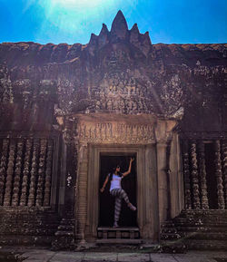 Woman standing outside building