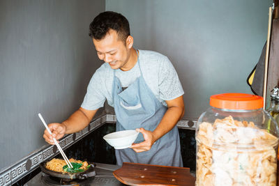 Man preparing food in kitchen