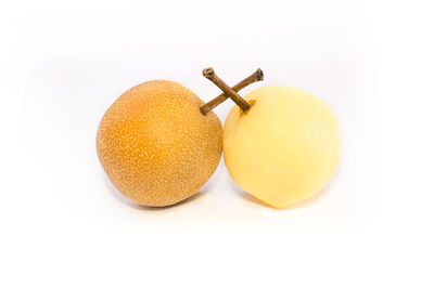 Close-up of oranges against white background