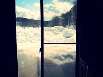 Scenic view of snow covered mountains against sky