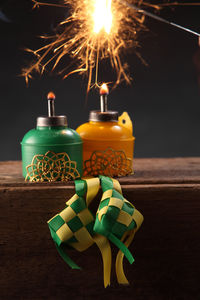 Close-up of candles with decoration on table