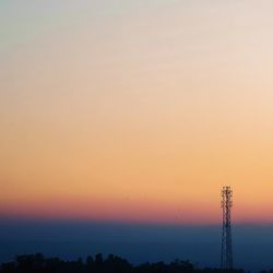 Silhouette trees against sky during sunset