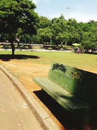 Park by trees against sky