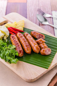 High angle view of meat on barbecue grill