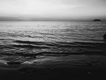 Scenic view of sea against sky at sunset