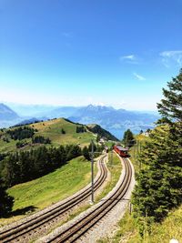 Scenic view of landscape against blue sky