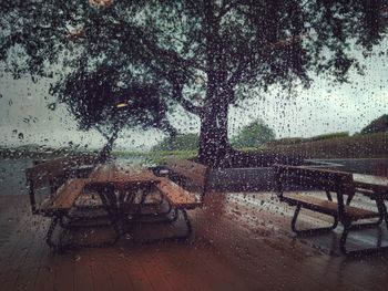 Raindrops on puddle during rainy season