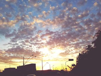 Low angle view of cloudy sky at sunset