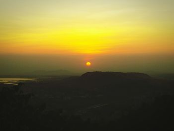 Scenic view of landscape against sky during sunset