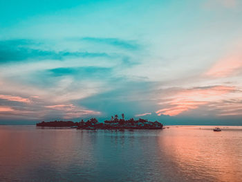 Scenic view of sea against cloudy sky