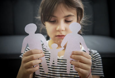Close-up of young woman with teddy bear