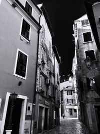 Low angle view of buildings in city against sky