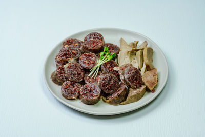 High angle view of food in plate on white background