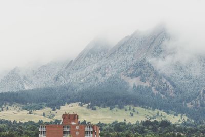 Scenic view of mountains during foggy weather
