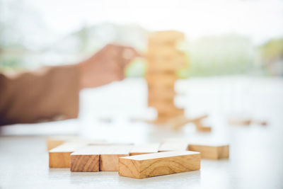 Close-up of wooden toy blocks at desk in office