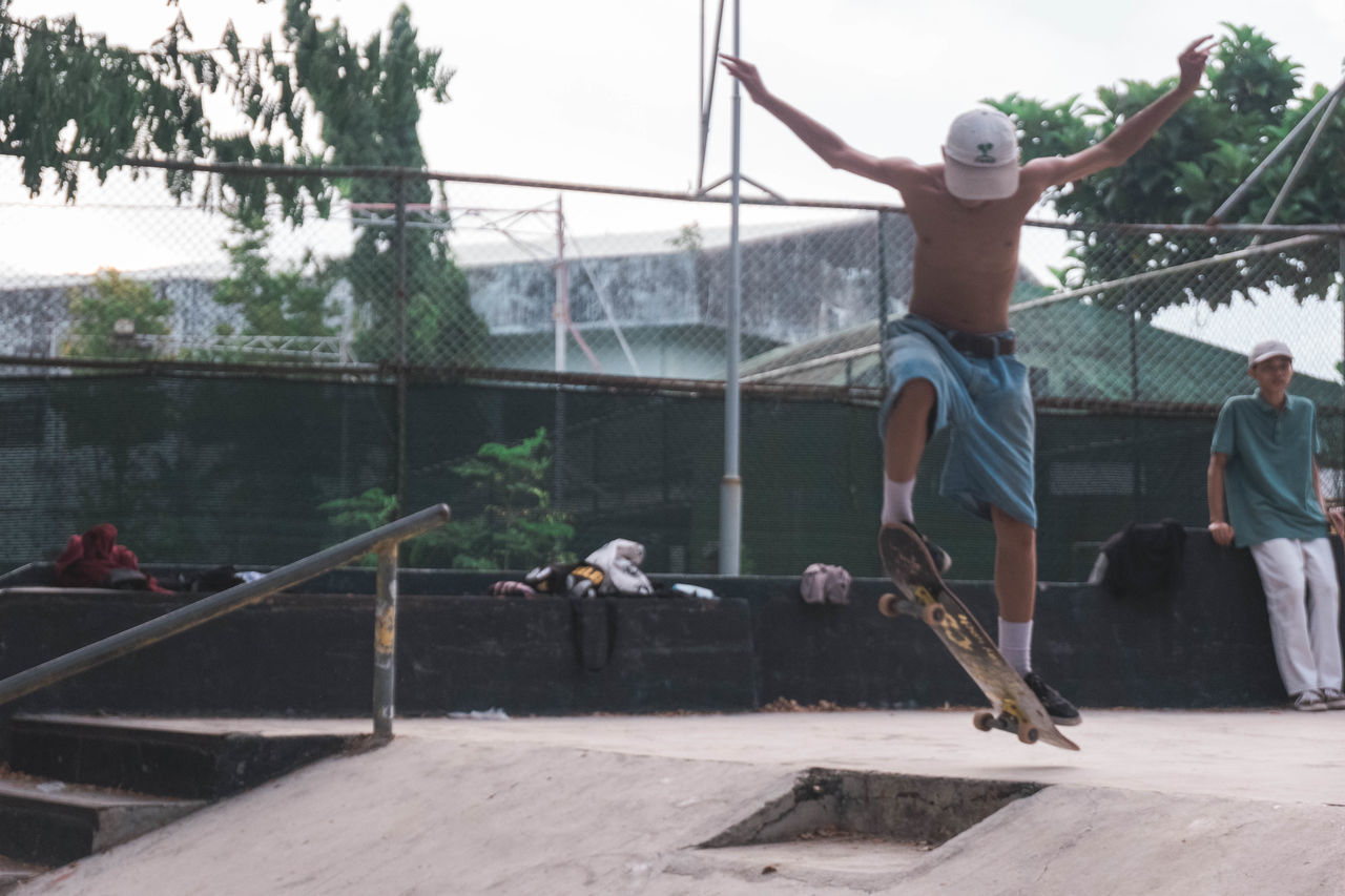 PEOPLE JUMPING AGAINST TREES