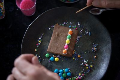 Preparing homemade gingerbread houses for christmas 2021