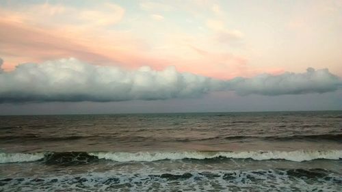 Scenic view of beach at sunset