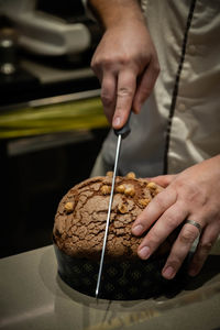 Midsection of man preparing food