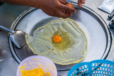 High angle view of person preparing food in kitchen